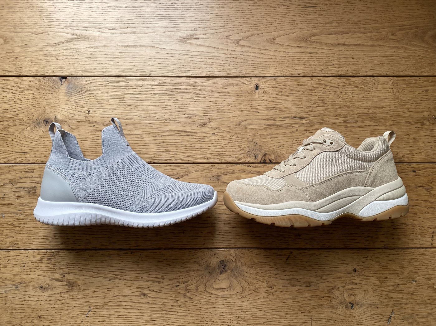 A slip-in sneaker next to an extra-wide walking shoe