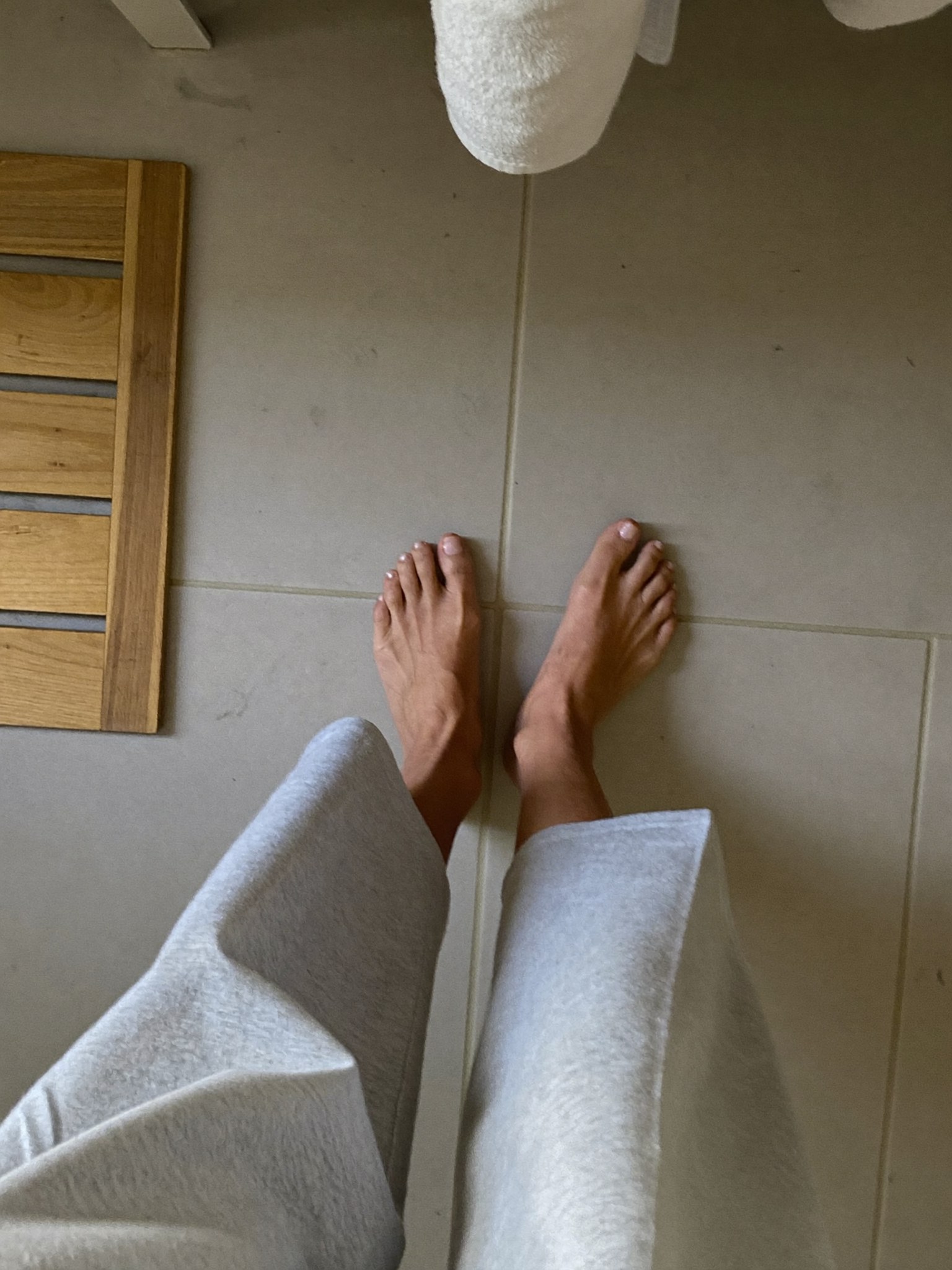 Bare feet on a tile floor